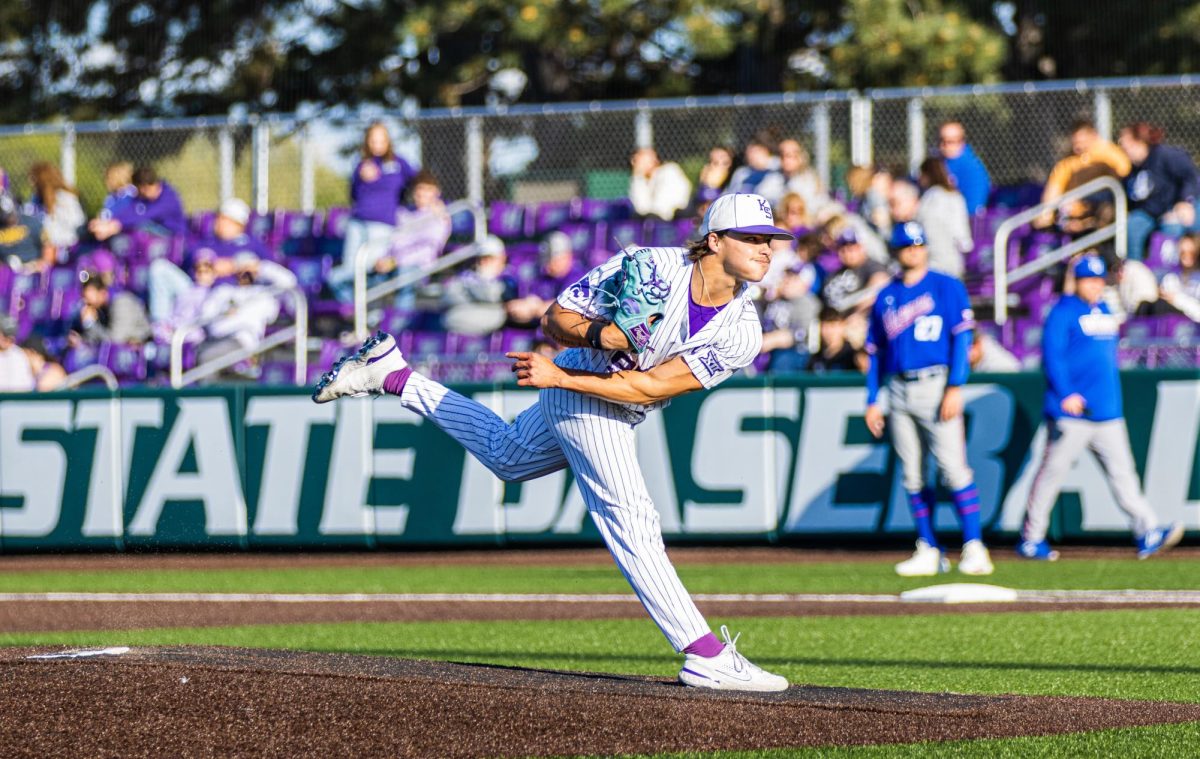 Left-handed pitcher JJ Slack follows through with his pitch. Kansas on May 4 for the Sunflower Showdown at Tointon Family Stadium. They fell to the Jayhawks 4-0 but went on to win the series 2-1. Photo by Haylee Haslett.